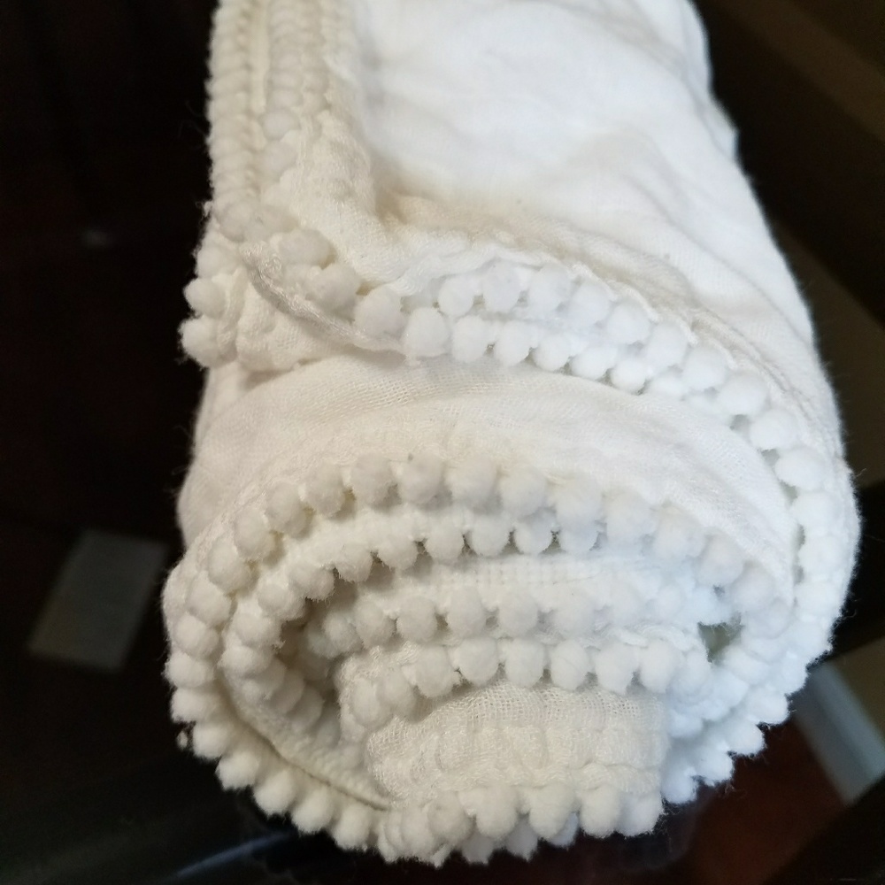 pom pom lined bamboo swaddlers blanket